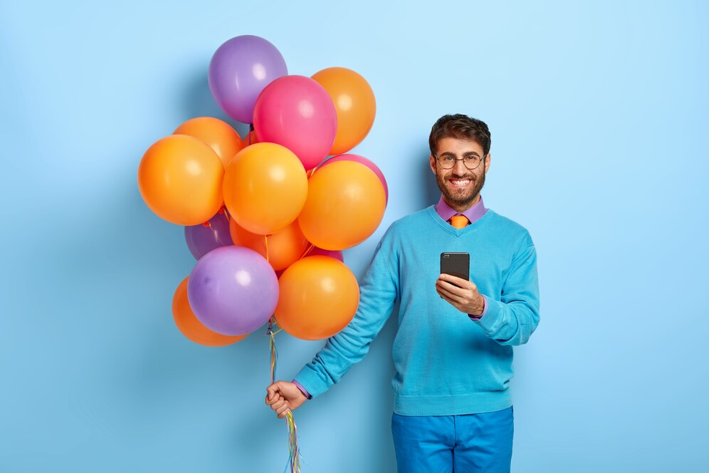 glad guy with balloons posing blue sweater 273609 31589